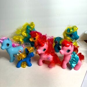 Mix of 7 my little pony dolls. Different color and sizes. Condition is pre-owned